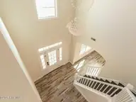 211 Cheswick Drive, Holly Ridge, NC 28445 — 3-bedroom home in The Preserve At Morris Landing, Holly Ridge, NC, photo 10 of 65: Foyer chandelier