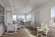 202 Glenn Street, Atlantic Beach, NC 28512 — 5-bedroom waterfront home in Money Island Beach, Atlantic Beach, NC, photo 10 of 21: Sunroom