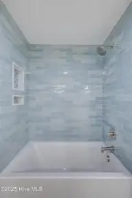 125 Cove Side Lane, Hampstead, NC 28443 — 4-bedroom waterfront home in Pelican Sound, Hampstead, NC, photo 24 of 29: bathroom upstairs