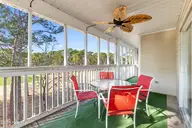 3350 Club Villas Drive # 405, Southport, NC 28461 — 2-bedroom condo in St James, Southport, NC, photo 1 of 39: Screened porch