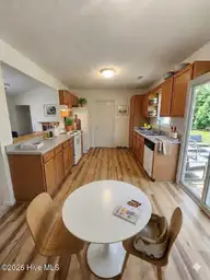 243 Parnell Road, Hubert, NC 28539 — 3-bedroom home in Foxtrace, Hubert, NC, photo 8 of 26: Kitchen AI Staged