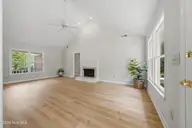 312 Wendover Lane, Wilmington, NC 28411 — 3-bedroom home in Wendover, Wilmington, NC, photo 10 of 35: LR from kitchen towards fireplace