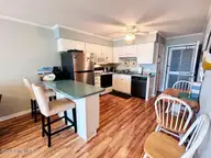 918 Carolina Beach Avenue N 2b, Carolina Beach, NC 28428 — 2-bedroom waterfront condo in A Place At The Beach, Carolina Beach, NC, photo 9 of 28: 918 CB Ave N 2B kitdin