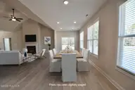63 Waterfall Lane, Whiteville, NC 28472 — 4-bedroom waterfront home in Waterfall Estates, Whiteville, NC, photo 17 of 22: Breakfast and Sunroom