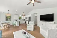 118 Periwinkle Drive, Emerald Isle, NC 28594 — 3-bedroom home in Shell Cove, Emerald Isle, NC, photo 13 of 39: 13 Living room into kitchen