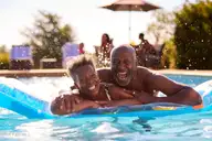 1247 Evening Walk Ne 134, Winnabow, NC 28479 — 3-bedroom home in Bell Meadows, Winnabow, NC, photo 21 of 23: Couple in Pool_shutterstock_2197972651_9
