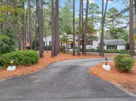 255 Lake Dornoch Drive, Pinehurst, NC 28374 — 4-bedroom waterfront home in CCNC, Pinehurst, NC, photo 9 of 69: Driveway 1