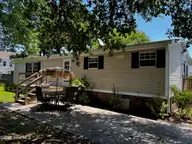 907 Kontiki Court, Hampstead, NC 28443 — 2-bedroom manufactured home in Topsail Greens, Hampstead, NC, photo 1 of 12