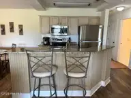 330 S Middleton Drive NW Unit 505, Calabash, NC 28467 — 2-bedroom waterfront condo in Brunswick Plantation, Calabash, NC, photo 15 of 72: 505 breakfast bar