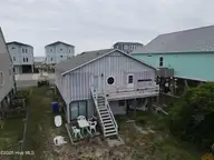 3518 E Beach Drive, Oak Island, NC 28465 — 3-bedroom waterfront home in E. Long Beach, Oak Island, NC, photo 4 of 39: DJI_0269