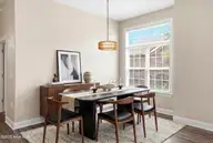 613 Elfin Court, Leland, NC 28479 — 2-bedroom townhome in Westport, Leland, NC, photo 10 of 28: Dining Room Virtually Staged