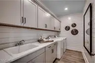 67 Lilaput Circle, Wilmington, NC 28411 — 3-bedroom home in Indigo at Abbey Preserve, Wilmington, NC, photo 18 of 27: Laundry Room