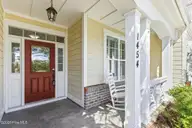 1454 Dunes Boulevard SW, Ocean Isle Beach, NC 28469 — 4-bedroom home in Retreat At OIB, Ocean Isle Beach, NC, photo 4 of 52: Perfect for front porch sittin'