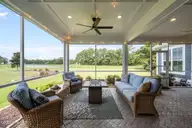 222 Twining Rose Lane, Holly Ridge, NC 28445 — 4-bedroom waterfront home in Summerhouse On Everett Bay, Holly Ridge, NC, photo 17 of 62: Outdoor Living Area