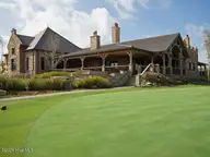 8815 10 Carenden Court, Sunset Beach, NC 28468 — waterfront lot in Thistle Downs, Sunset Beach, NC, photo 15 of 22: clubhouse_rear