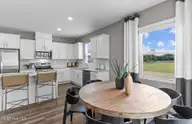 208 Ocean Pointe Boulevard SE 5301, Bolivia, NC 28422 — 4-bedroom home in Ocean Pointe, Bolivia, NC, photo 3 of 17: Untitled design - Ibis Kitchen and Dinin