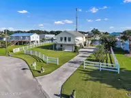 126 Dolphin Bay Estates, Cedar Point, NC 28584 — 3-bedroom waterfront home in Dolphin Bay Estates, Cedar Point, NC, photo 2 of 29: 02_beyc6ab2a9841be0d