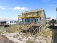 1717 W Beach Drive, Oak Island, NC 28465 — 4-bedroom waterfront home, Oak Island, NC, photo 3 of 60: 6-web-or-mls-DJI_20260416115838_0895_D
