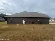208 S Merganser Drive, Pikeville, NC 27863 — 3-bedroom home in Mallard Pointe, Pikeville, NC, photo 6 of 43: Side of House