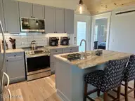 323 Caswell Beach Road, Oak Island, NC 28465 — 5-bedroom waterfront home in Caswell Beach, Oak Island, NC, photo 7 of 54: 323 Caswell Beach