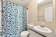 1530 Salter Path Road 15, Indian Beach, NC 28512 — 2-bedroom waterfront manufactured home in Tradewinds, Indian Beach, NC, photo 23 of 32: Guest Bath