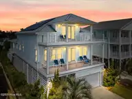 7004 E Beach Drive, Oak Island, NC 28465 — 4-bedroom waterfront home in Paradise Shores, Oak Island, NC, photo 2 of 71: 002-www