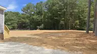 9757 Fire Tower Farm Road, Whitakers, NC 27891 — 3-bedroom manufactured home in Swift Creek Fire Tower, Whitakers, NC, photo 6 of 48: 7-web-or-mls-DJI_20260820132136_0547_D