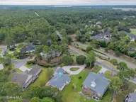 1806 Urchin Lane SE, Bolivia, NC 28422 — 3-bedroom waterfront home in Winding River Plantation, Bolivia, NC, photo 4 of 61: aerial 2