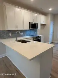 100 S Bandwheel Way, Hampstead, NC 28443 — 3-bedroom home in Sawyers Run, Hampstead, NC, photo 5 of 20: KITCHEN