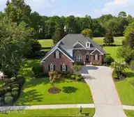 1009 West Cove Loop, Leland, NC 28451 — 4-bedroom home in Magnolia Greens, Leland, NC, photo 1 of 33