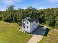 210 River Oats Court, Holly Ridge, NC 28445 — 4-bedroom waterfront home in Redd's Cove, Holly Ridge, NC, photo 6 of 69: 4_front right exterior