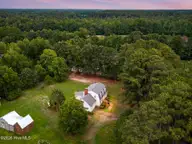 696 Laurie Ellis Road, Winterville, NC 28590 — 4-bedroom home, Winterville, NC, photo 3 of 57: drone_main2