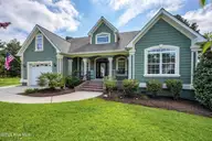 800 Marsh Rose Path NW, Calabash, NC 28467 — 4-bedroom home in Meadowlands, Calabash, NC, photo 1 of 60: 05-100_a7409009_skyvueA