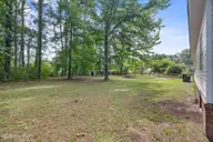 211 Pond Road, Rocky Point, NC 28457 — 3-bedroom manufactured home in Arvida Lands, Rocky Point, NC, photo 24 of 36: 25_backyard