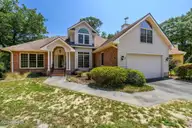 514 Woods Court SW, Sunset Beach, NC 28468 — 3-bedroom home in Sea Trail Plantation, Sunset Beach, NC, photo 3 of 50: 22-web-or-mls-15 front