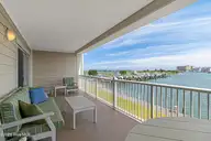 212 Old Causeway Road 107 & B13 Slip, Beaufort, NC 28516 — 3-bedroom waterfront condo in Morgan Creek Landing, Beaufort, NC, photo 7 of 49: Covered balcony