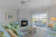2555 St James Drive SE Unit 101, Southport, NC 28461 — 3-bedroom condo in St James, Southport, NC, photo 15 of 53: Living Room