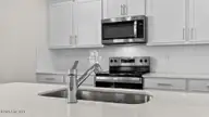 285 Maddox Drive, Aberdeen, NC 28315 — 4-bedroom home in Martin Farms, Aberdeen, NC, photo 9 of 31: Kitchen