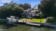 152 Arborvitae Drive, Pine Knoll Shores, NC 28512 — 3-bedroom waterfront home in Pine Knoll Association, Pine Knoll Shores, NC, photo 2 of 61: Overhead view back of house