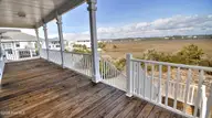 273 E Second Street, Ocean Isle Beach, NC 28469 — 5-bedroom home in Little Beach Landing, Ocean Isle Beach, NC, photo 22 of 58: RearPorch L-2