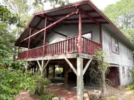 136 NE 21st Street, Oak Island, NC 28465 — 2-bedroom home in Tranquil Harbor, Oak Island, NC, photo 1 of 35