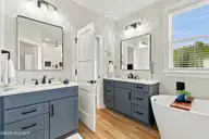 210 River Oats Court, Holly Ridge, NC 28445 — 4-bedroom waterfront home in Redd's Cove, Holly Ridge, NC, photo 19 of 69: 44_primary bathroom