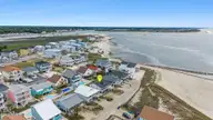 461 E Third Street, Ocean Isle Beach, NC 28469 — 4-bedroom waterfront home, Ocean Isle Beach, NC, photo 4 of 57: DJI_20260512105530_0840_D-1