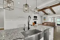 135 Spicer Lake Drive, Holly Ridge, NC 28445 — 4-bedroom waterfront home in Summerhouse On Everett Bay, Holly Ridge, NC, photo 14 of 75: Kitchen Island