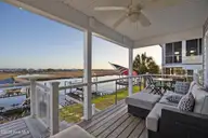 103 E Island Drive, Oak Island, NC 28465 — 3-bedroom waterfront home, Oak Island, NC, photo 10 of 76: 107_twilight