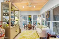 503 W Yacht Drive, Oak Island, NC 28465 — 4-bedroom home in Tranquil Harbor, Oak Island, NC, photo 13 of 53: Sunroom