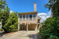 502 N Shore Drive W, Sunset Beach, NC 28468 — 3-bedroom waterfront home in Sunset Beach, Sunset Beach, NC, photo 1 of 50: 01-200_a7406087_skyvue