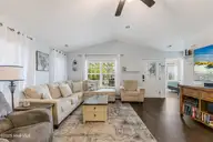 1803 W Yacht Drive, Oak Island, NC 28465 — 3-bedroom home in Pinners Point, Oak Island, NC, photo 8 of 39: Living room rom Dining