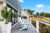212 Teakwood Drive, Carolina Beach, NC 28428 — 3-bedroom waterfront home in Pleasure Cay, Carolina Beach, NC, photo 6 of 46: Deck