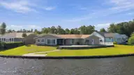 905 Grenada Court, New Bern, NC 28560 — 3-bedroom waterfront home in Fairfield Harbour, New Bern, NC, photo 1 of 21: 15-web-or-mls-DJI_0543
